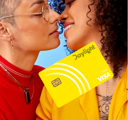 Two people kissing with a Daylight card in the foreground