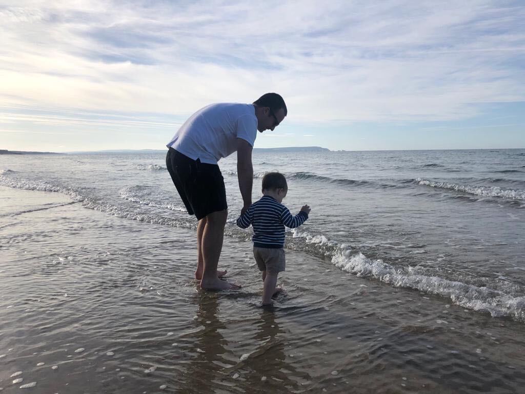Paul and child paddling in the sea